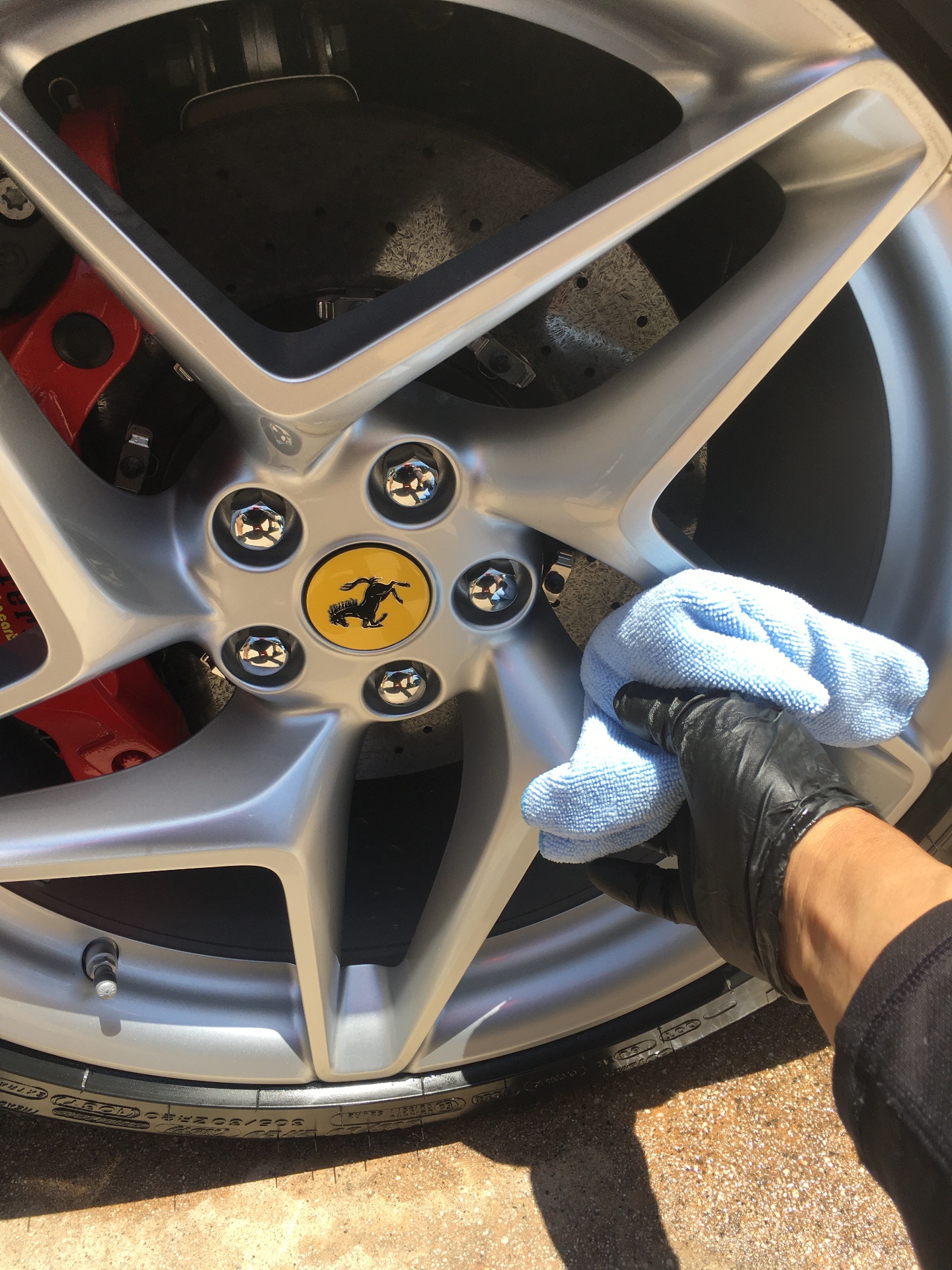 Ferrari wheel detail with red brake caliper