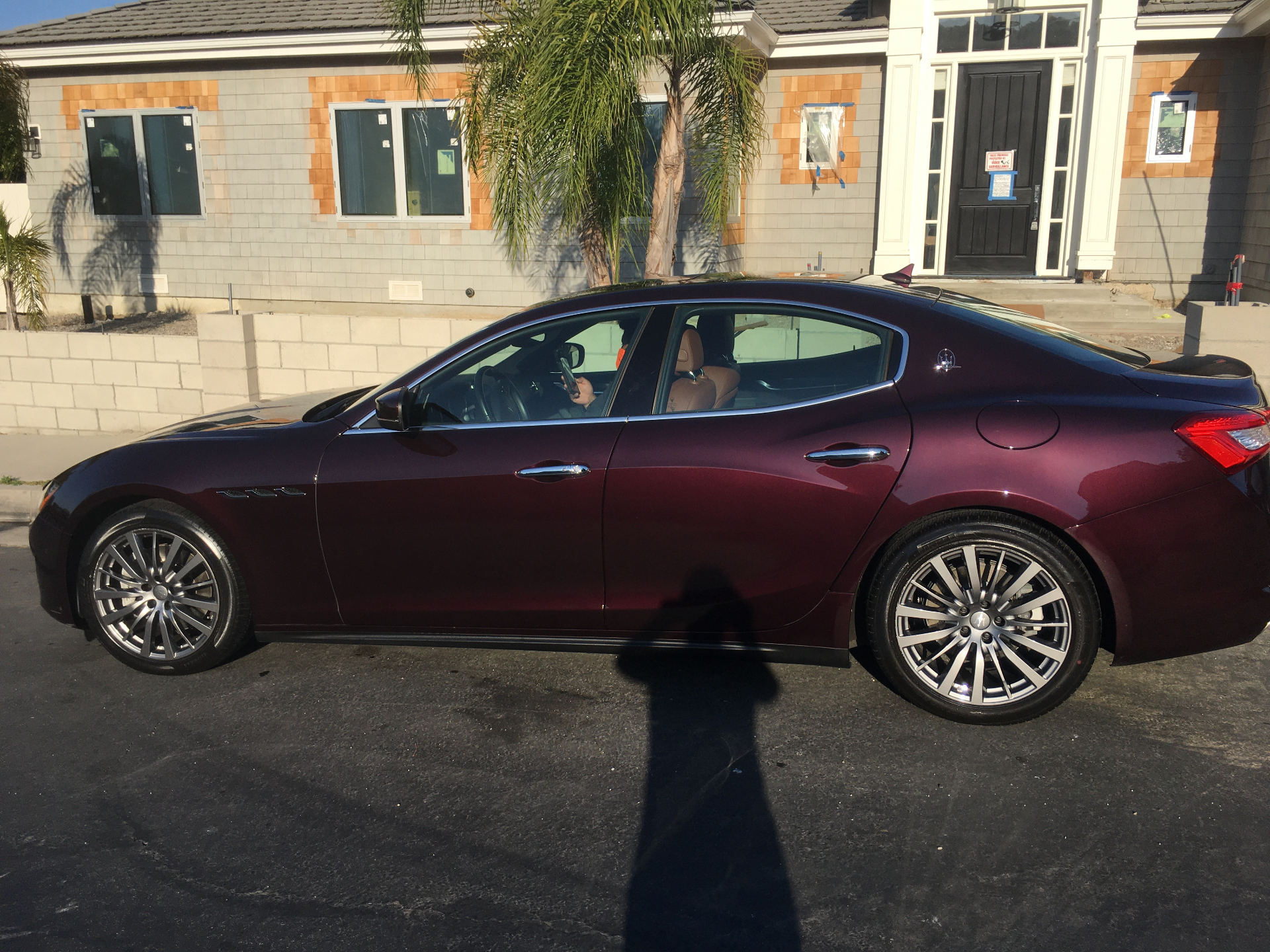 Burgundy Maserati sedan side profile detail