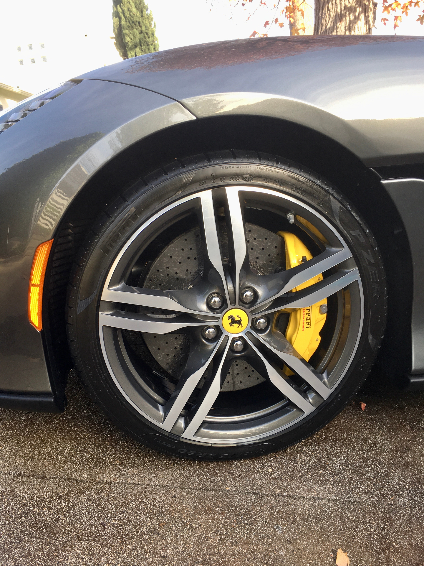 Ferrari wheel with yellow brake caliper close-up
