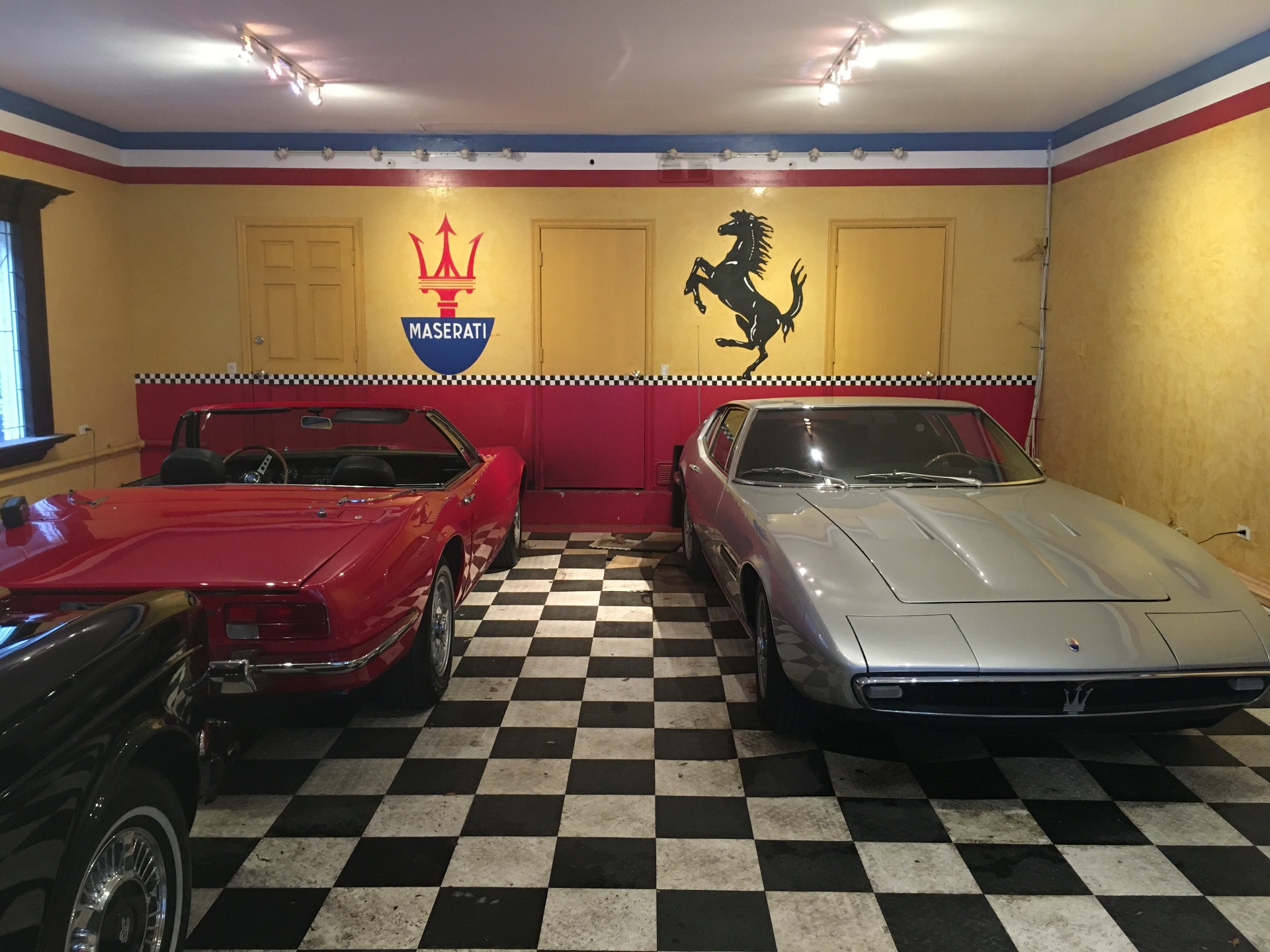 Classic Maserati and Ferrari collector garage