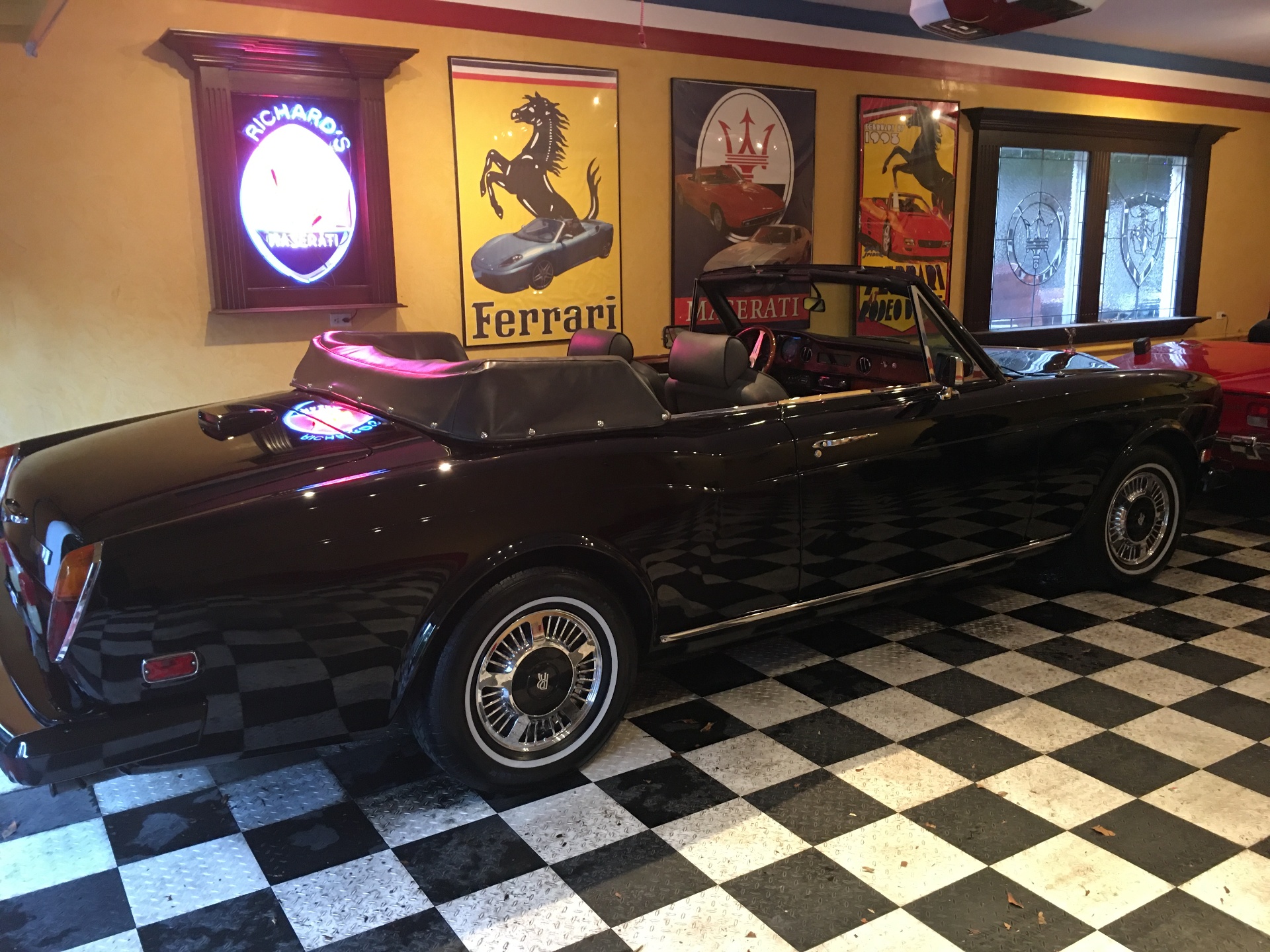 Classic Maserati convertible in showroom garage