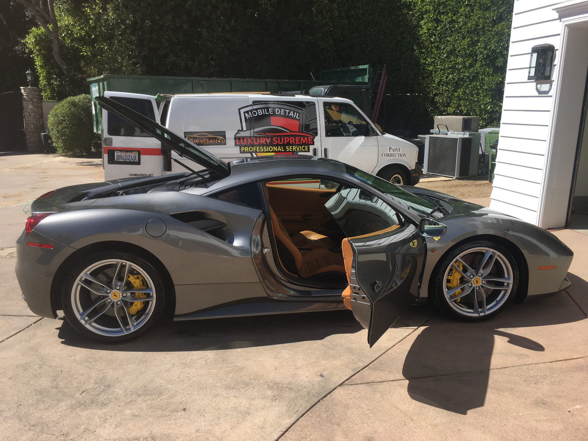 Ferrari 488 GTB with detailing van backdrop
